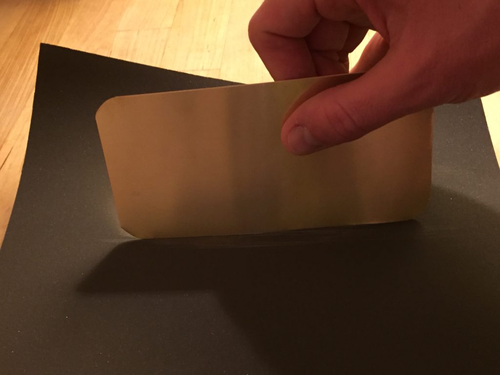 Sanding down the edges to prevent bleeding.