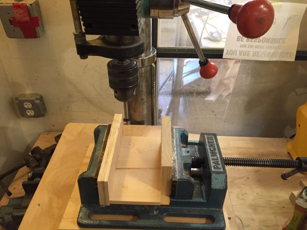 I used the drill press to drill starting points for the router in the four corners of the case.