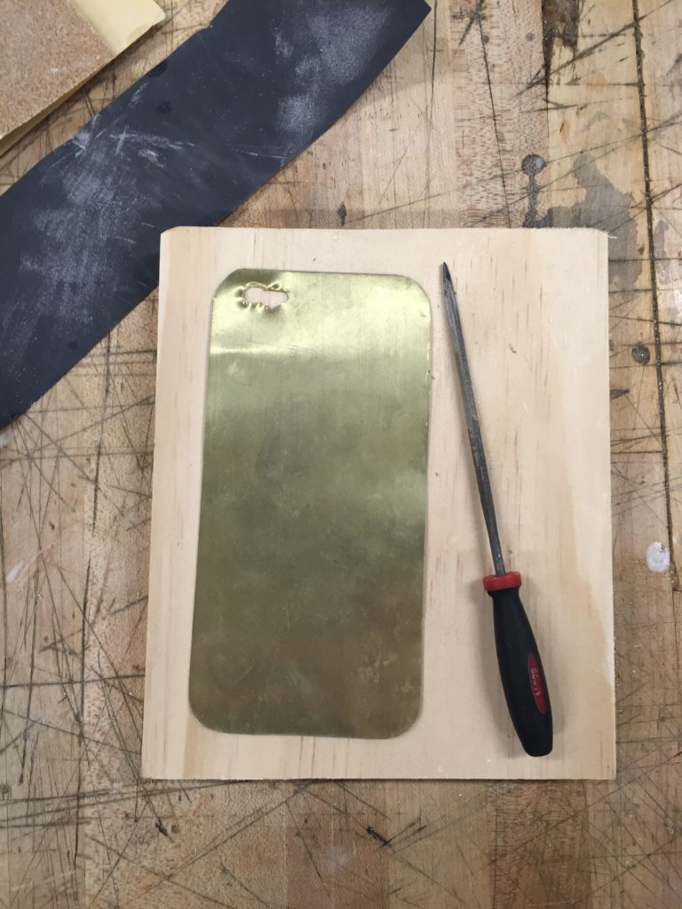 Filing down the jagged edges.